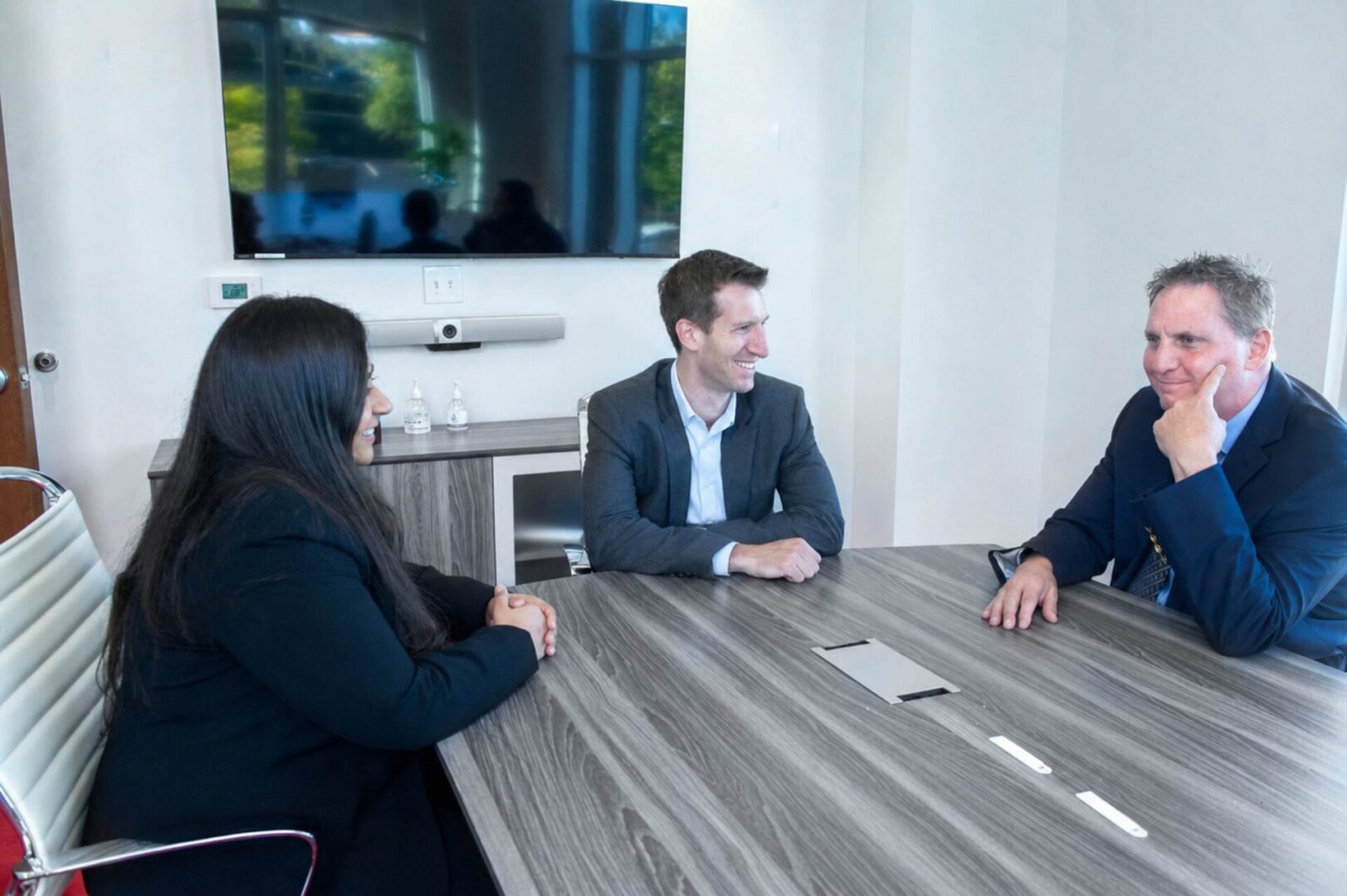 The Trove Consultants team meeting at a conference table